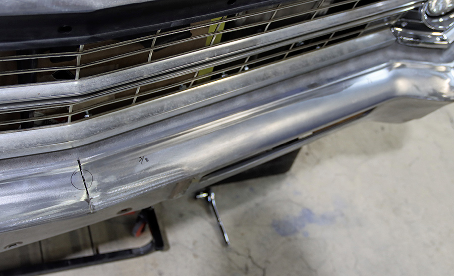  Marking the center of the bumper for cutting.