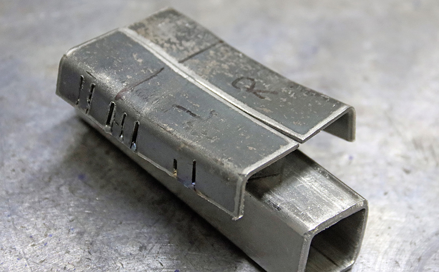 Metal pieces bent for the light opening.