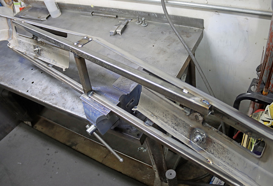 Bumper secured in fixture for center removal.
