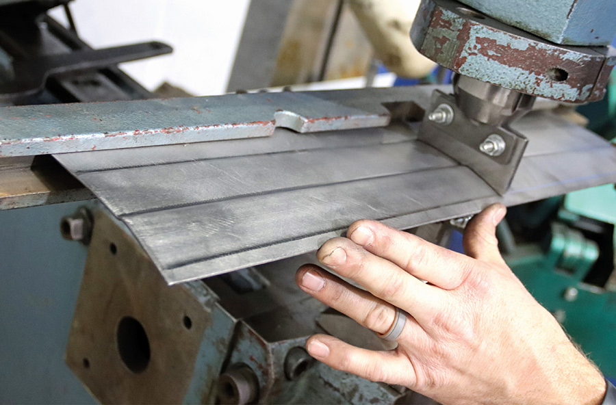 Stamping lines into the new center panel.