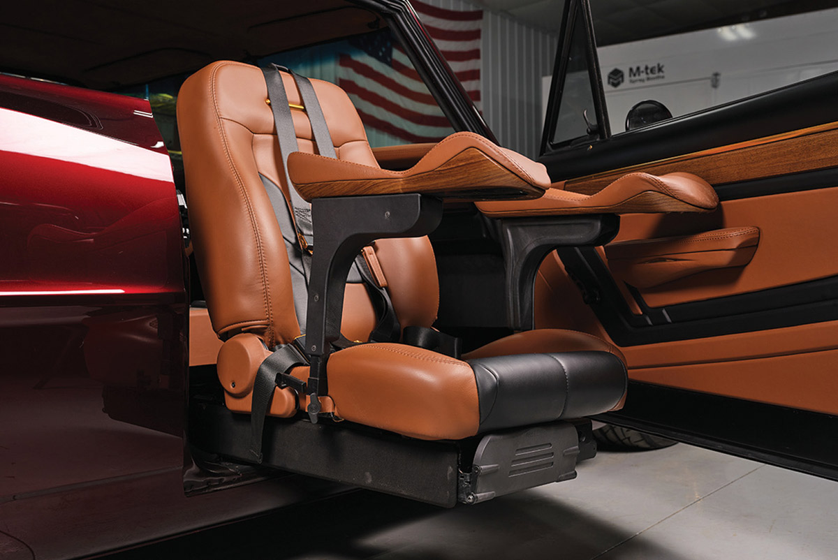 Swiveling passenger seat extended for wheelchair access.