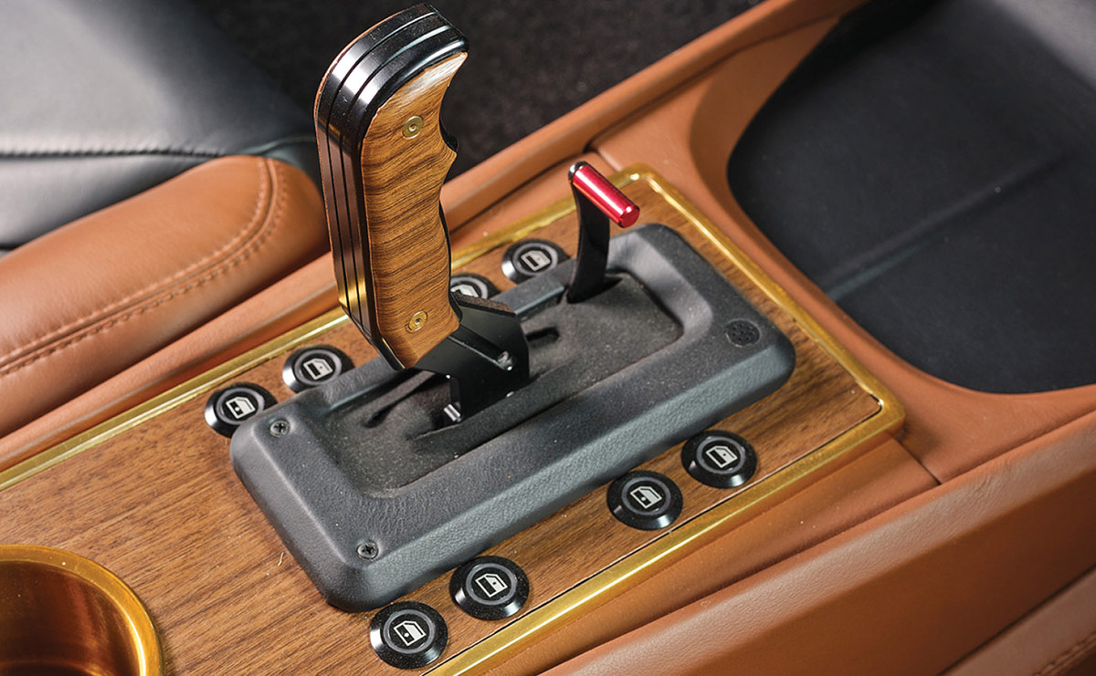 Detail of woodgrain shifter and window buttons.