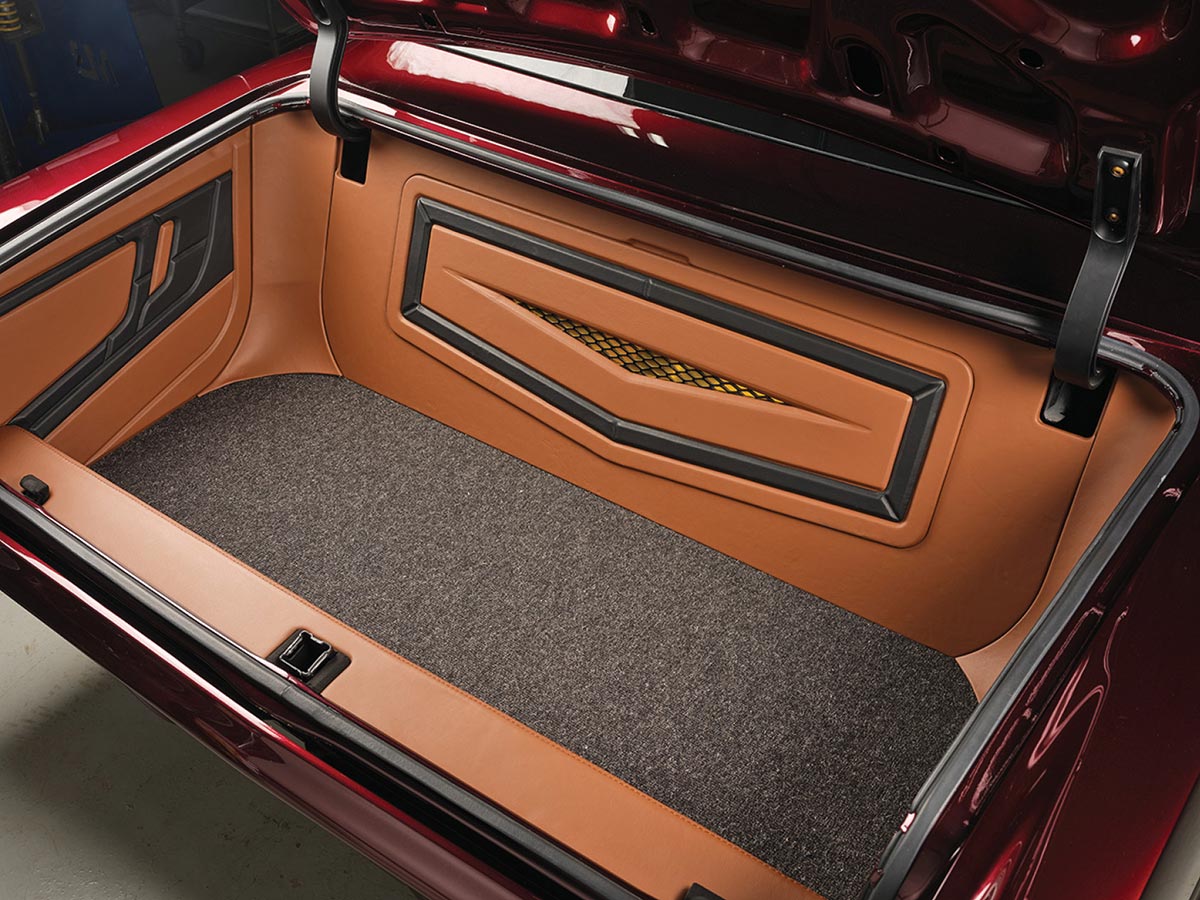 Custom upholstered trunk with leather panels.