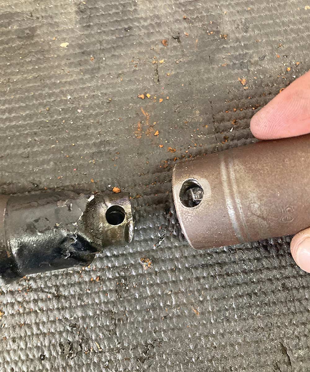 Failed steering shaft coupler and pin hole.