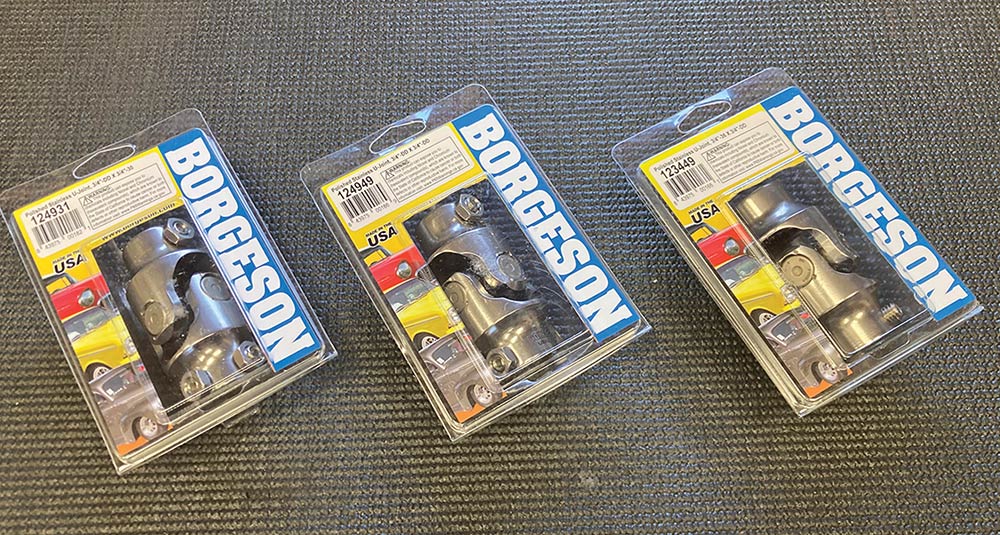 Assorted Borgeson universal joints in plastic packaging.