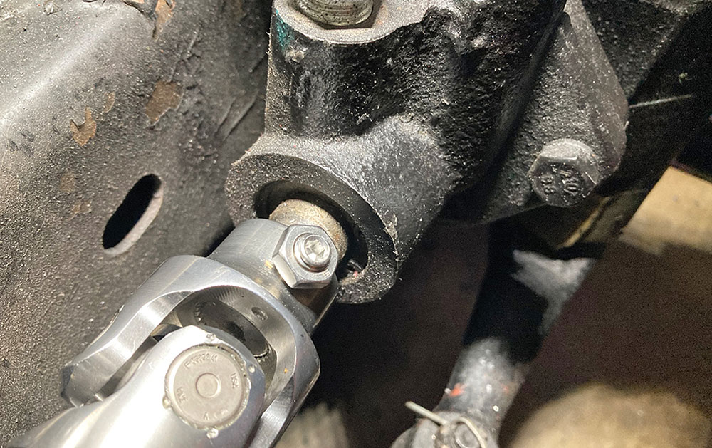 Detailed view of U-joint connection to steering box input.