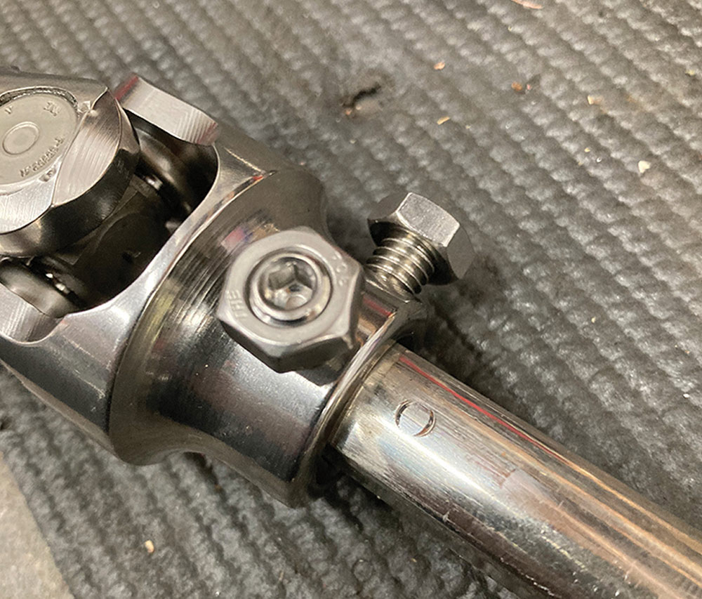 A small circular mark on the DD shaft from a pinch bolt.