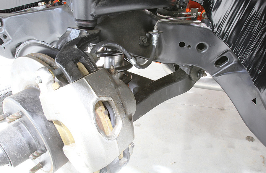 Detail of a new hydraulic flexible brake hose installed on front suspension.