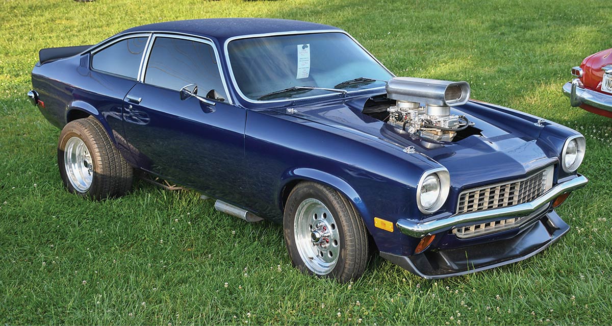 Blue Chevy Vega with massive blower and dual carburetors