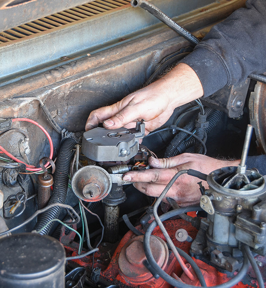 Removing the original HEI distributor from the engine.