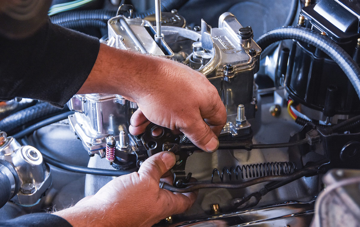 Connecting the modified throttle and kickdown cable bracket.