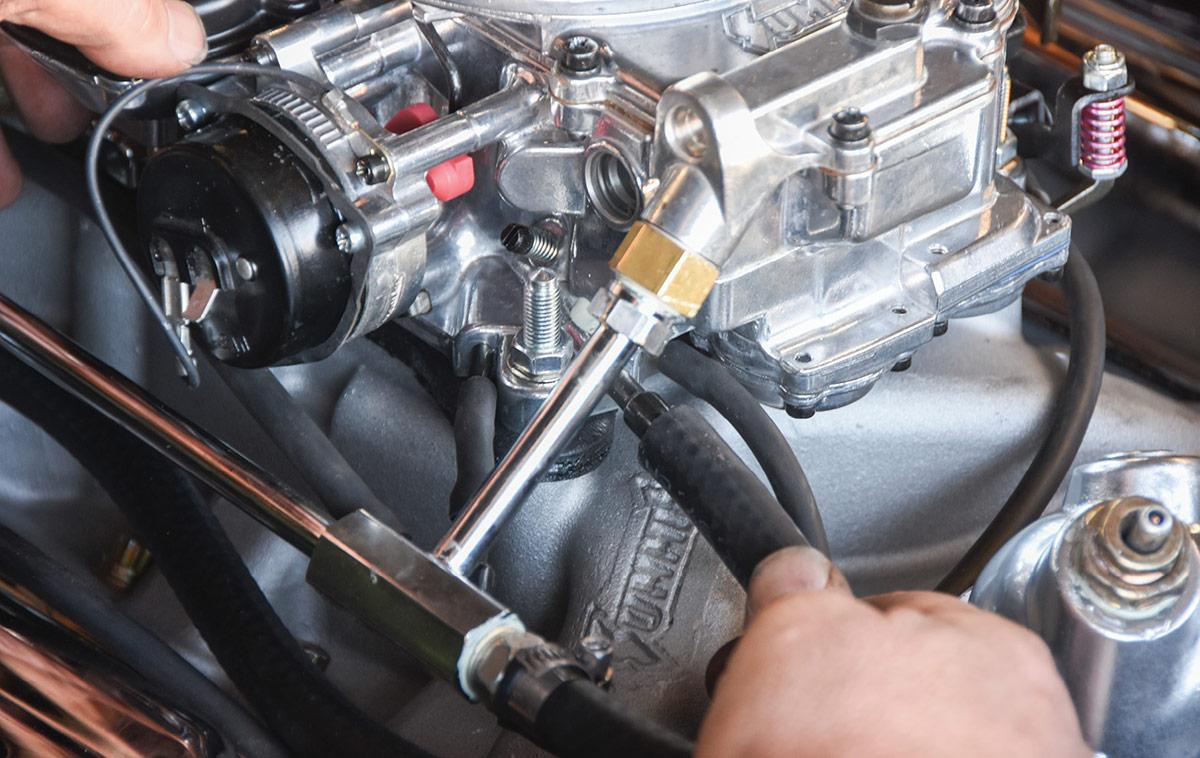 Checking vacuum port options on the new carburetor.