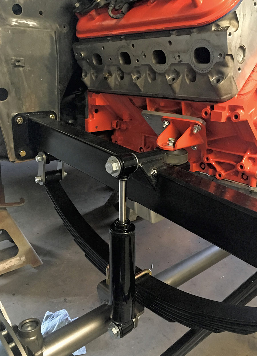 Front suspension leaf spring and shock absorber assembly.