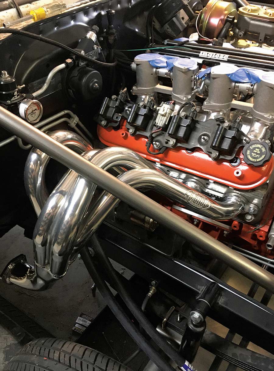 Polished headers installed on the engine in the bay.