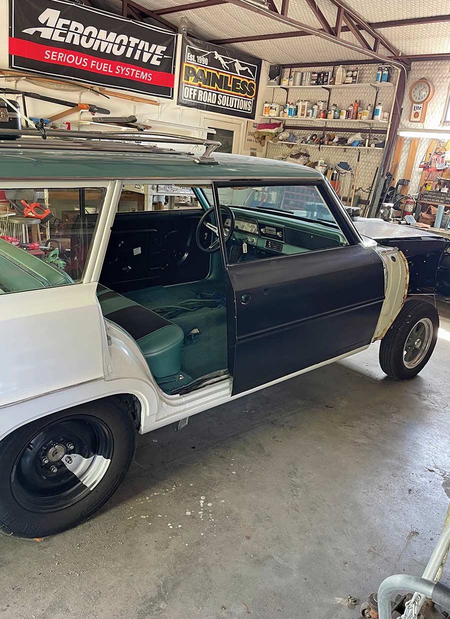 Passenger side view of the two-door conversion progress.