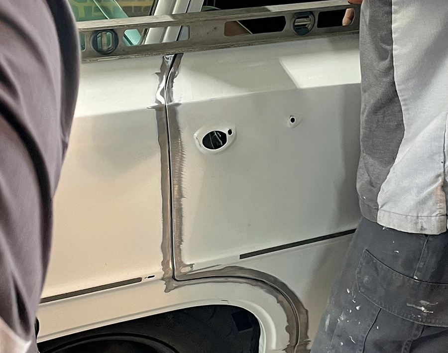 Aligning the shortened rear door with the car body.