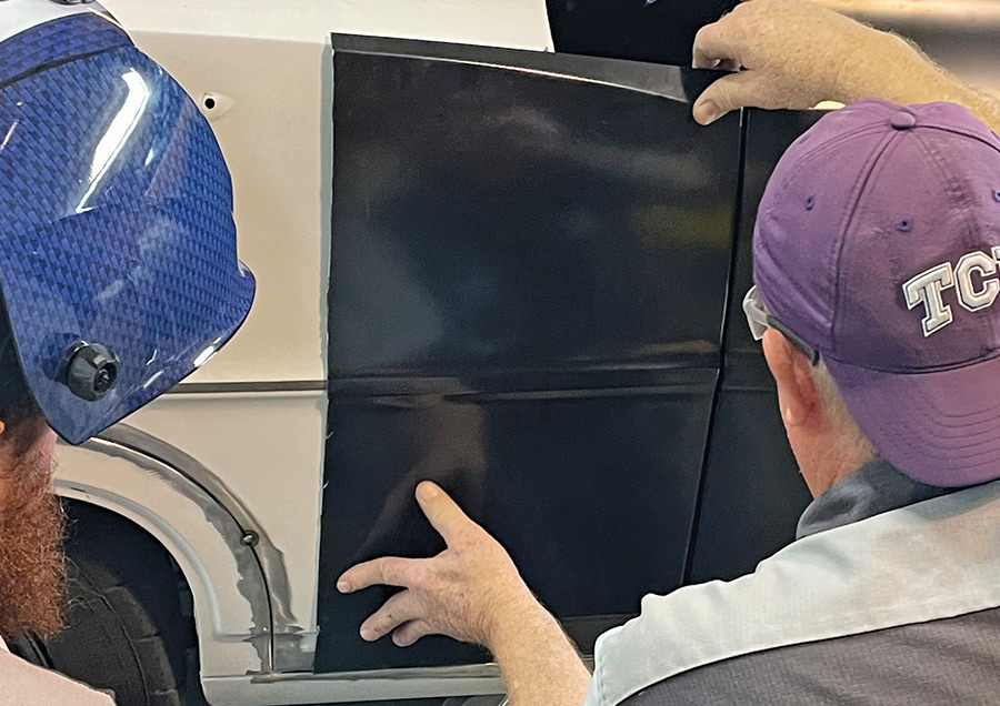 Welding a patch panel to the rear quarter panel.