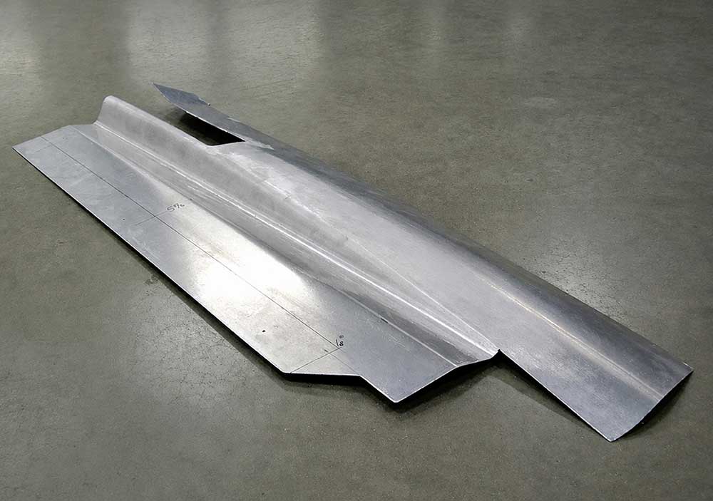Two metal sections welded and finished into one unit.