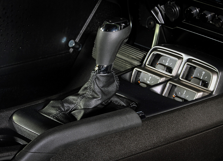 Modern shifter and center console with gauges.