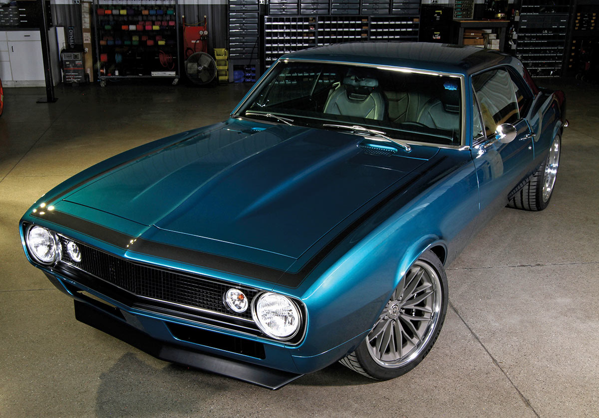 Wide-angle front view of the teal Camaro.