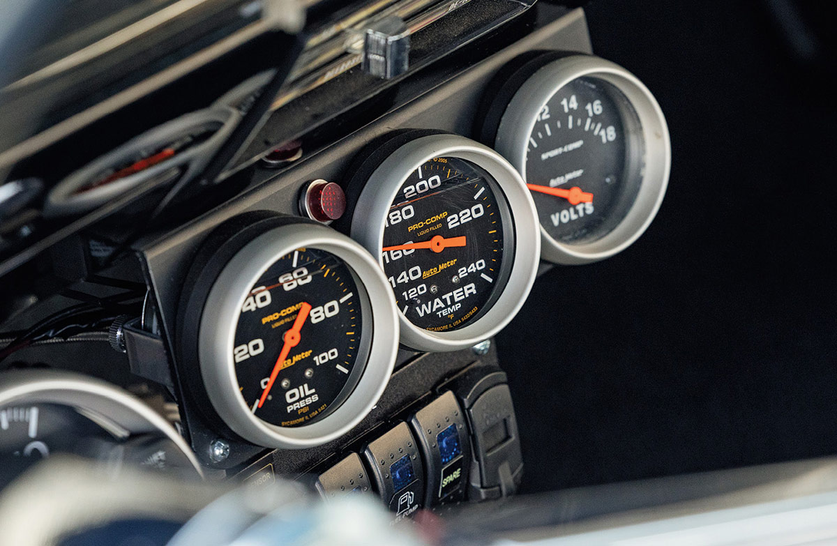 Three Auto Meter gauges mounted under the dashboard.