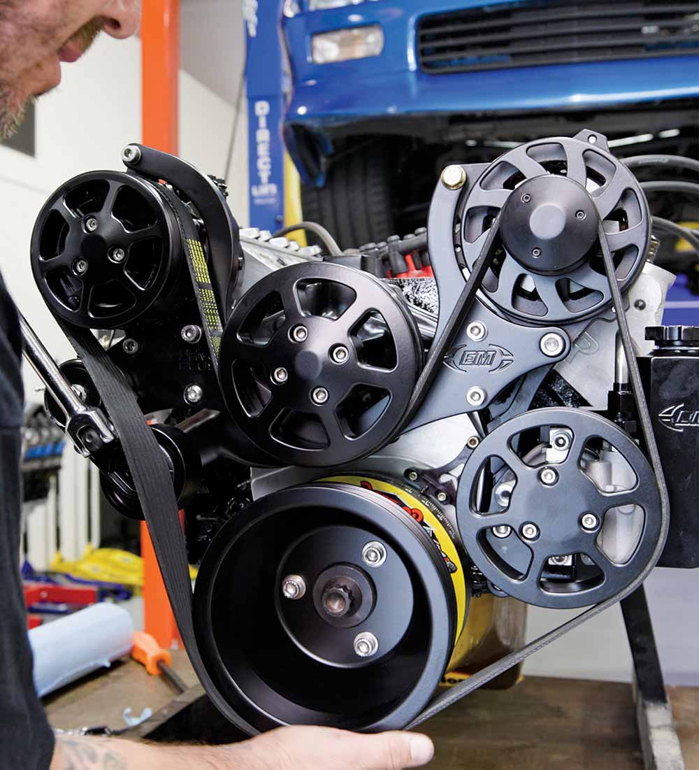 Serpentine accessory drive system featuring a compact Type II power steering pump.