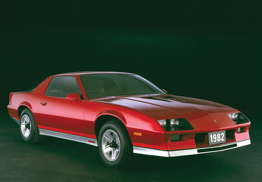 Red third-generation 1982 Camaro Z28 profile view.