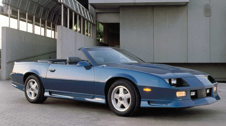 Blue 1991 Camaro Z28 convertible parked outdoors.