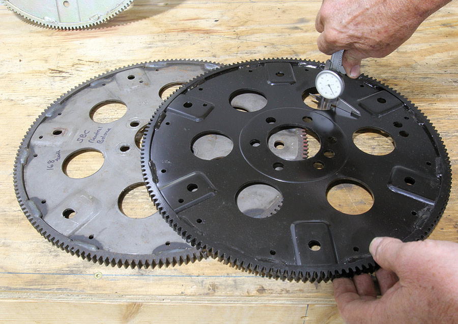 Measuring flexplate thickness with a dial caliper.