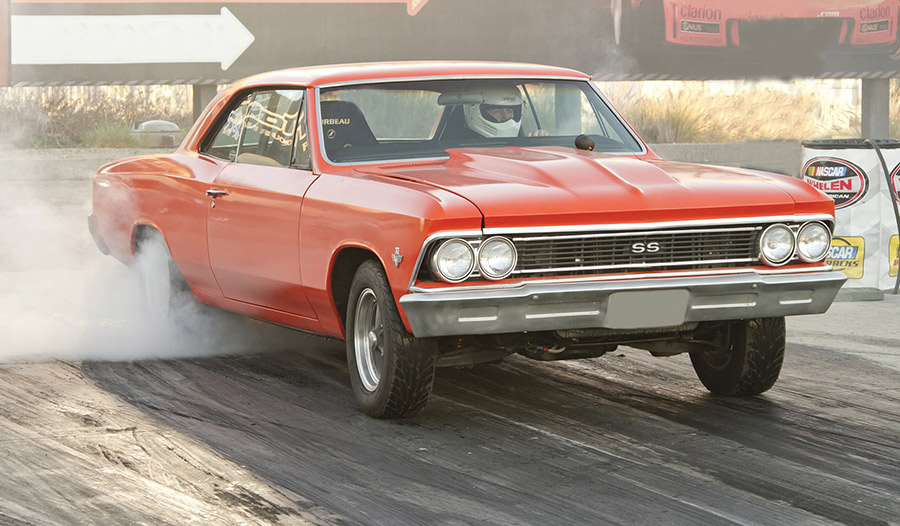 Red 1966 Chevelle SS drag racing pass.