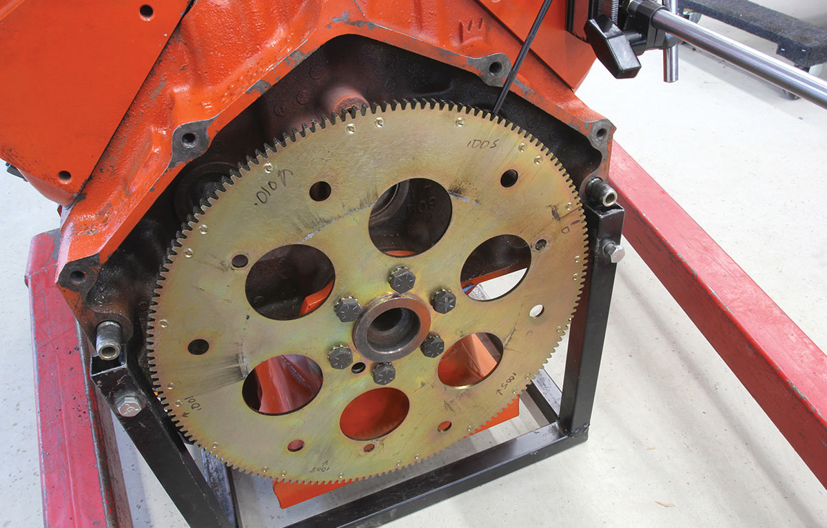Checking flexplate runout with a dial indicator.