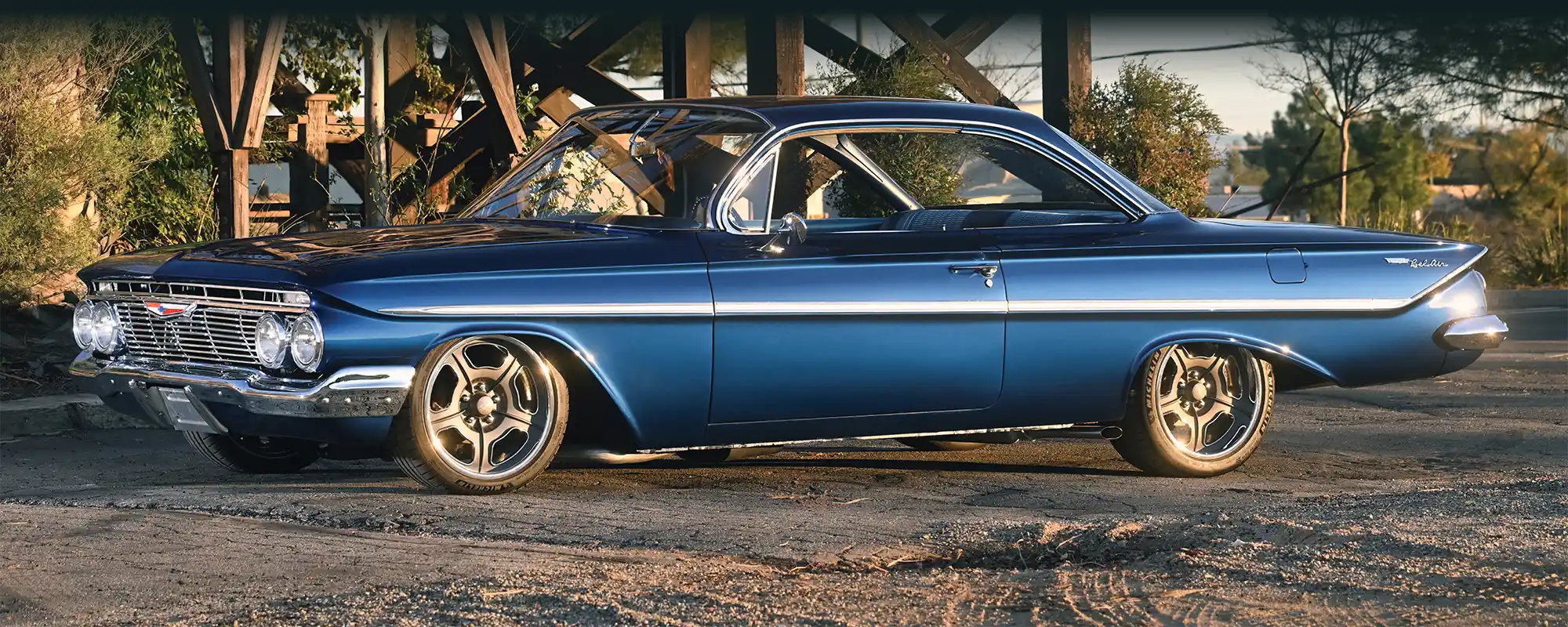 Blue 1961 Chevy Bel Air front three-quarter view.