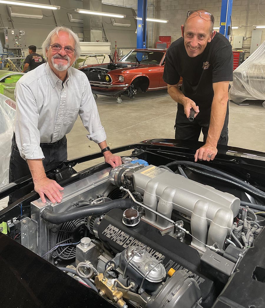 Steve Sbelgio and Marco Piehl discussing the engine conversion project.