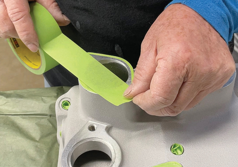 Masking manifold surfaces prior to painting.