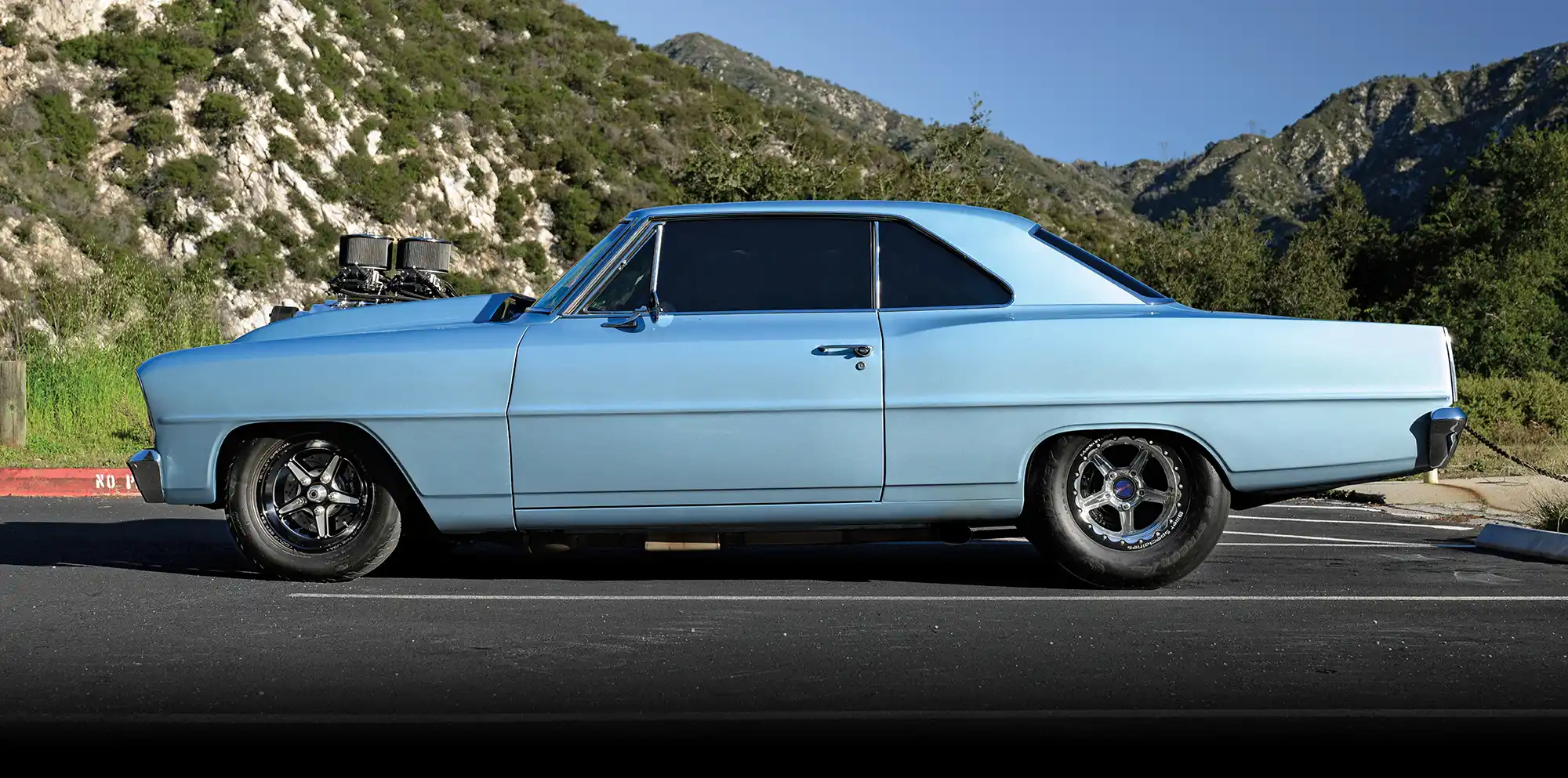 Side profile view of a Pro Street 1966 Chevy Nova.