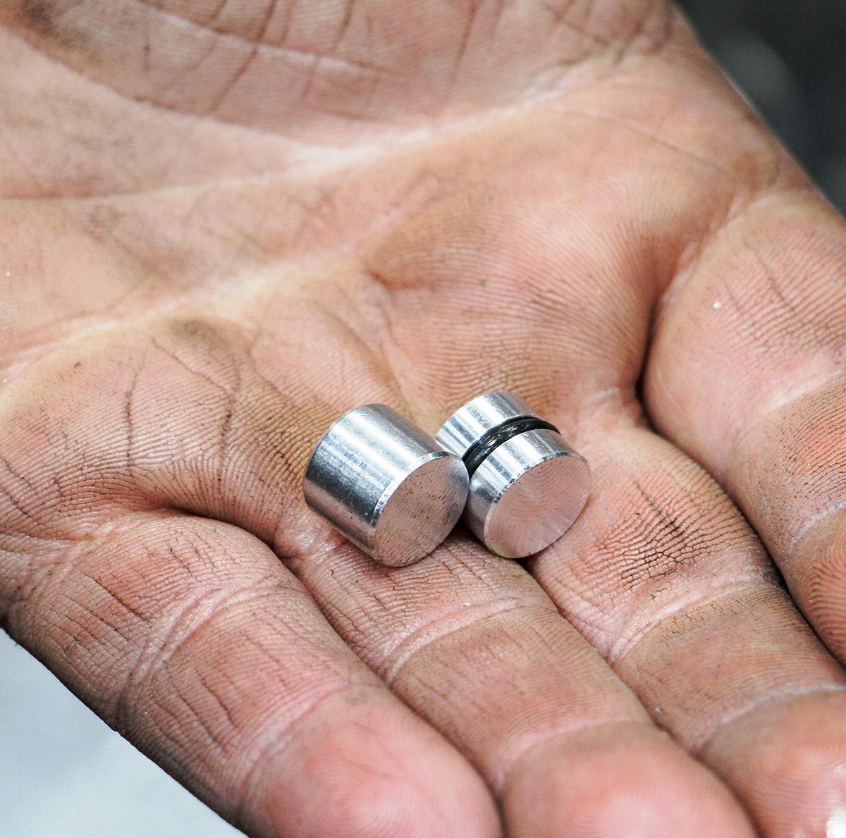 Stock versus billet valvebody end plugs.