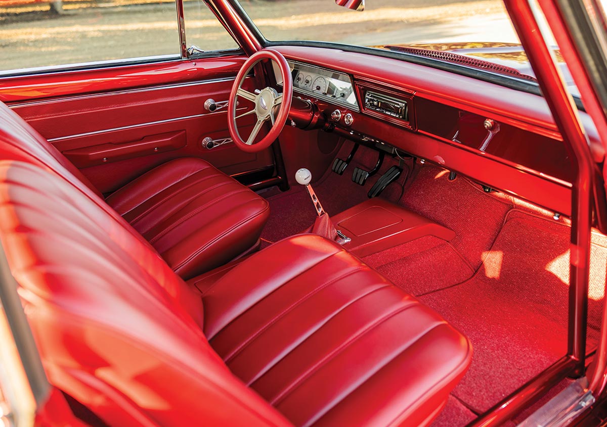 Custom red leather interior with bucket seats and center console.