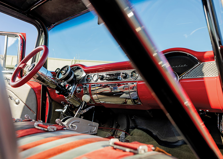 Custom red and gray dashboard with chrome accents.