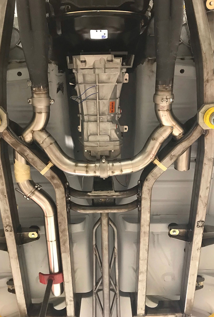 Custom stainless exhaust tucked high in chassis.